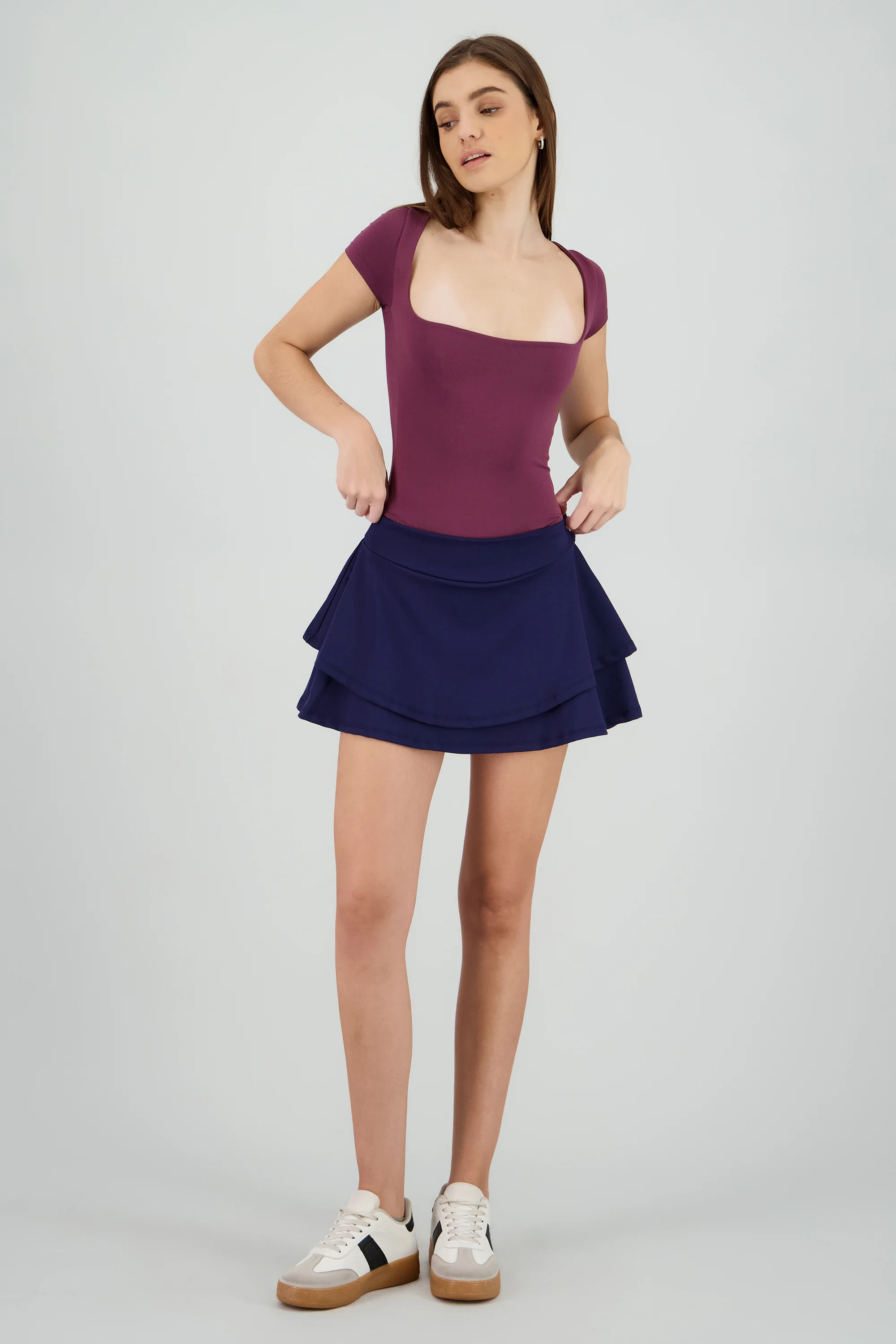 Falda mini doble olan pretina