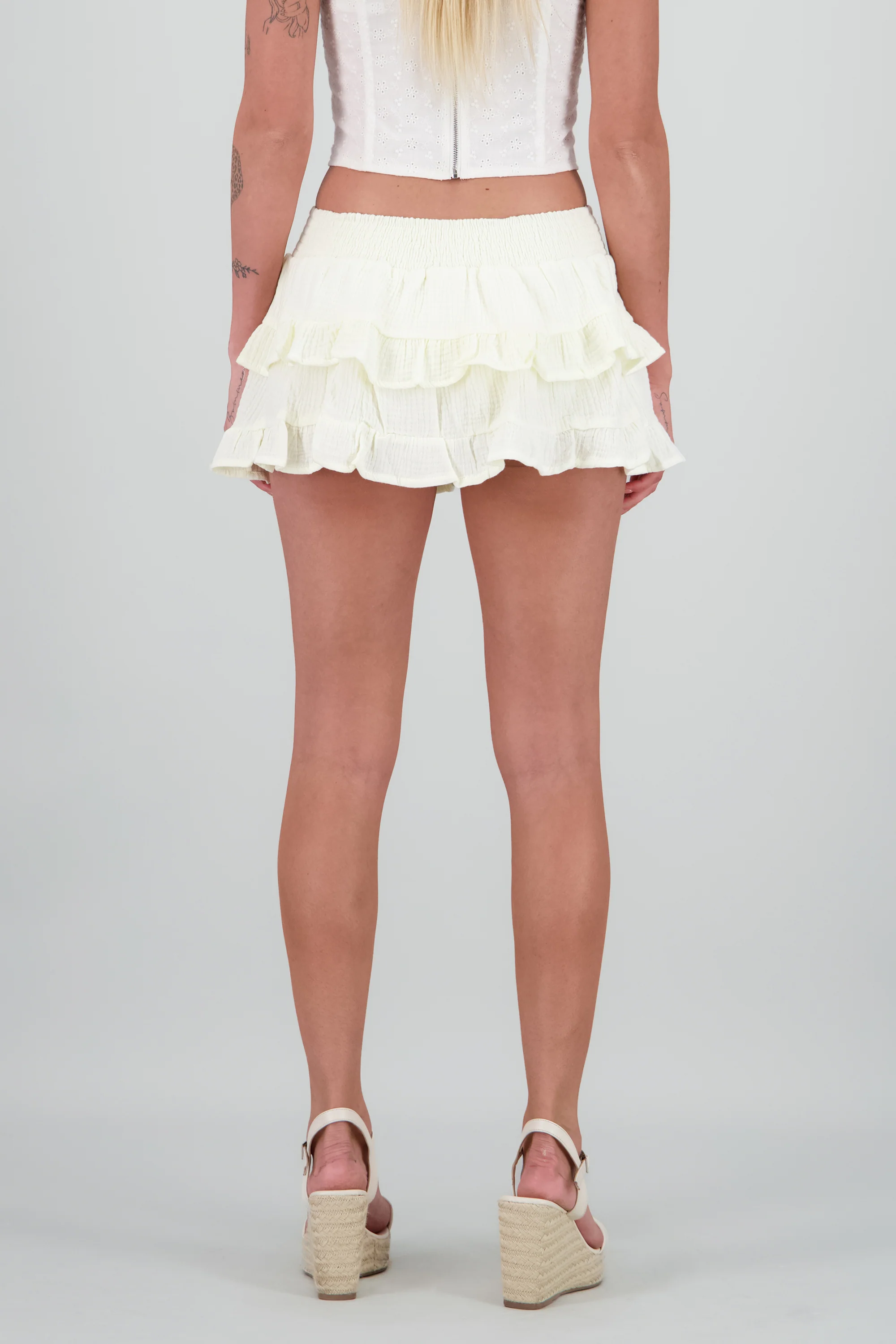 Falda short olanes lisa textura - Image 4