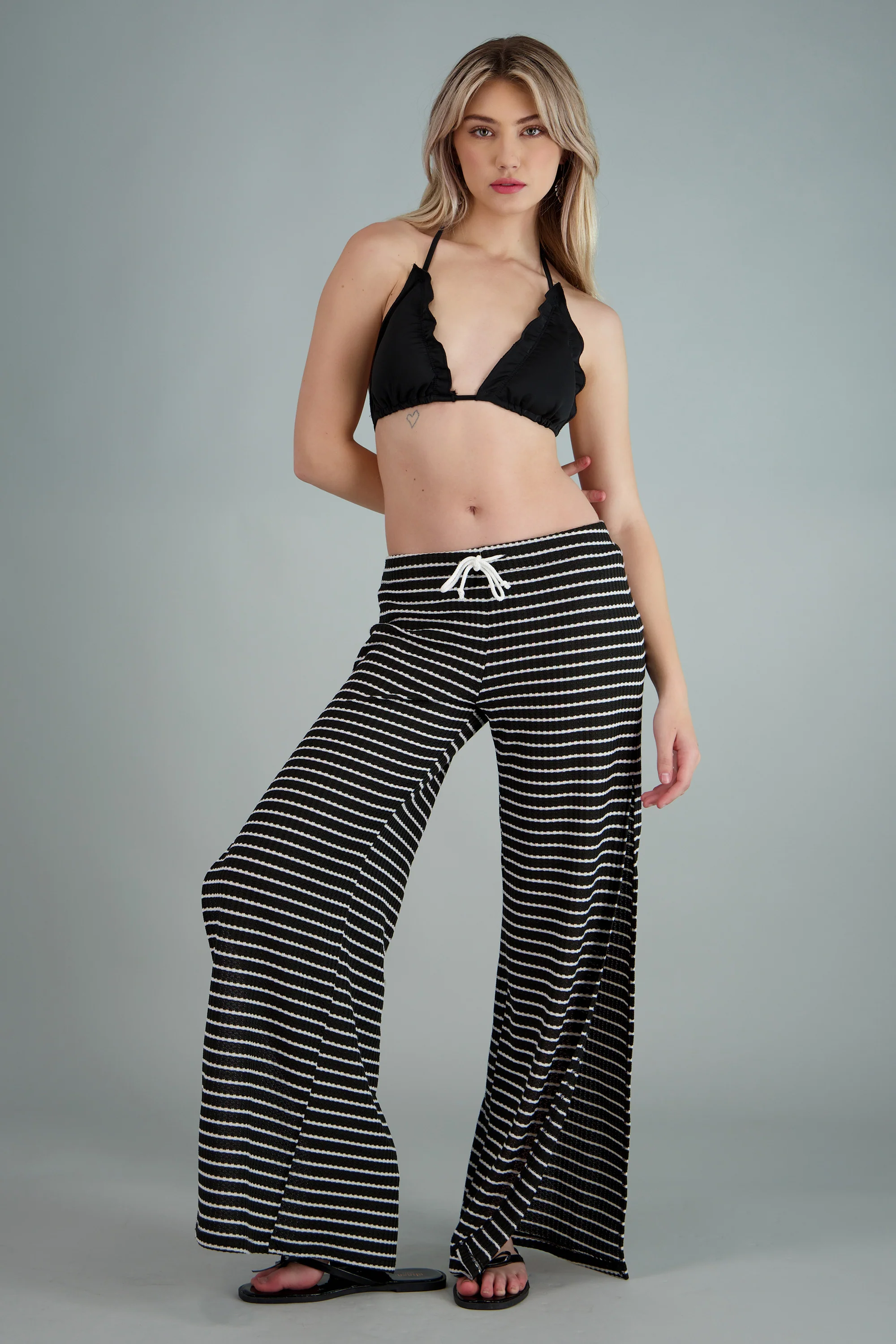 Pantalon textura tejida estampado rayas