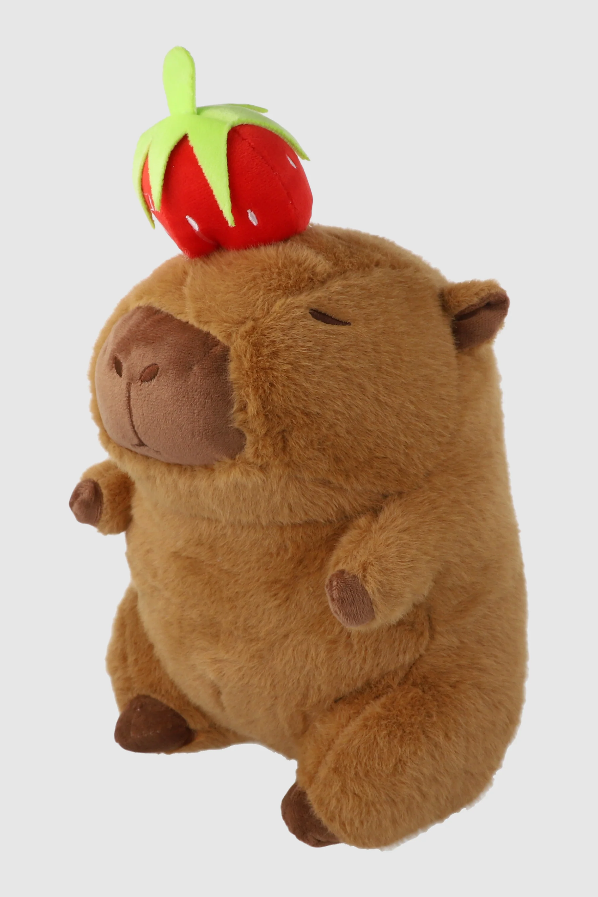 Peluche capibara con fruta